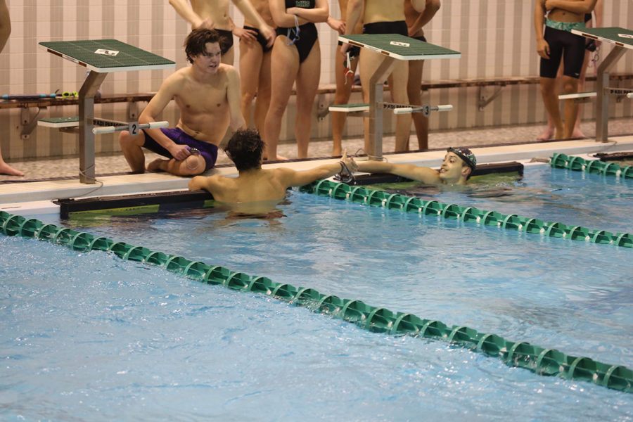 Senior Jenla Ruit shakes hands with her competitor after their race. 

