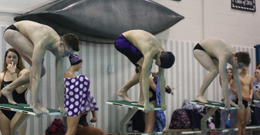 (from left) Jon Groff and (third from left) Ryan Valley get ready to dive in for one of their events. 
