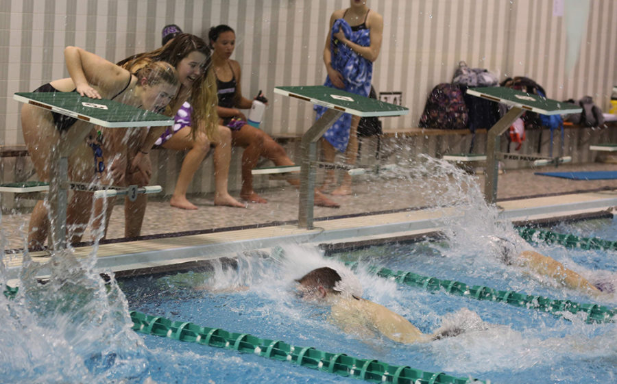 Girls cheer on Jon Groff as he approaches the wall for a very close race finish in the 500 free. 
