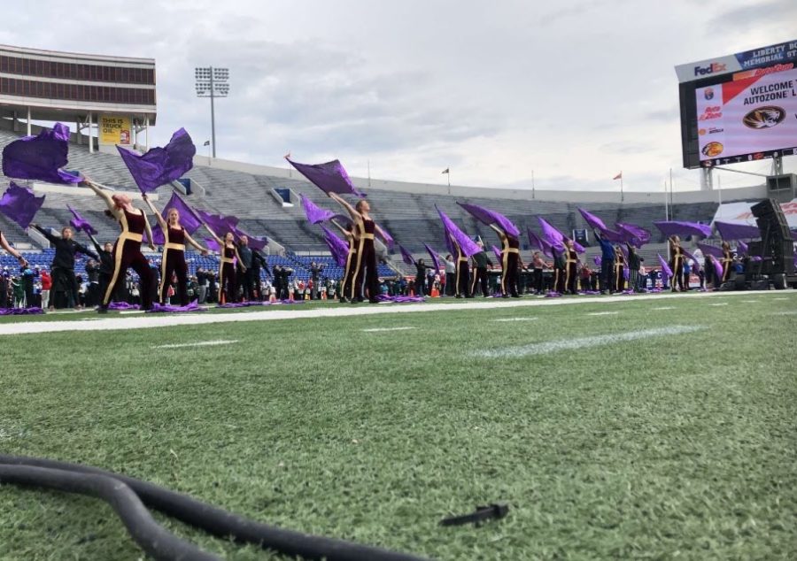 The MHS color guard, along with nine other high schools guards, practiced for the halftime show. 
