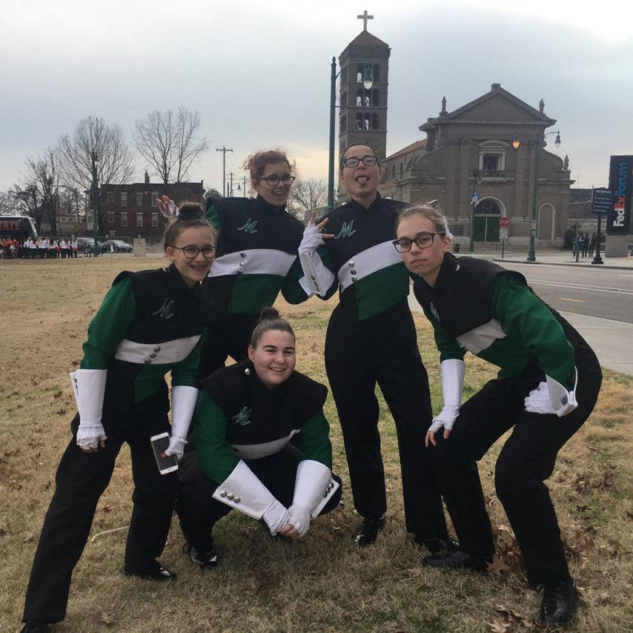 (from left) Olivia Kraynak, Katherine Hoehl, Sarah Rothe, Cassidy Crenshaw and Cecilia Weaver, the flutes gather prior to the parade.  
