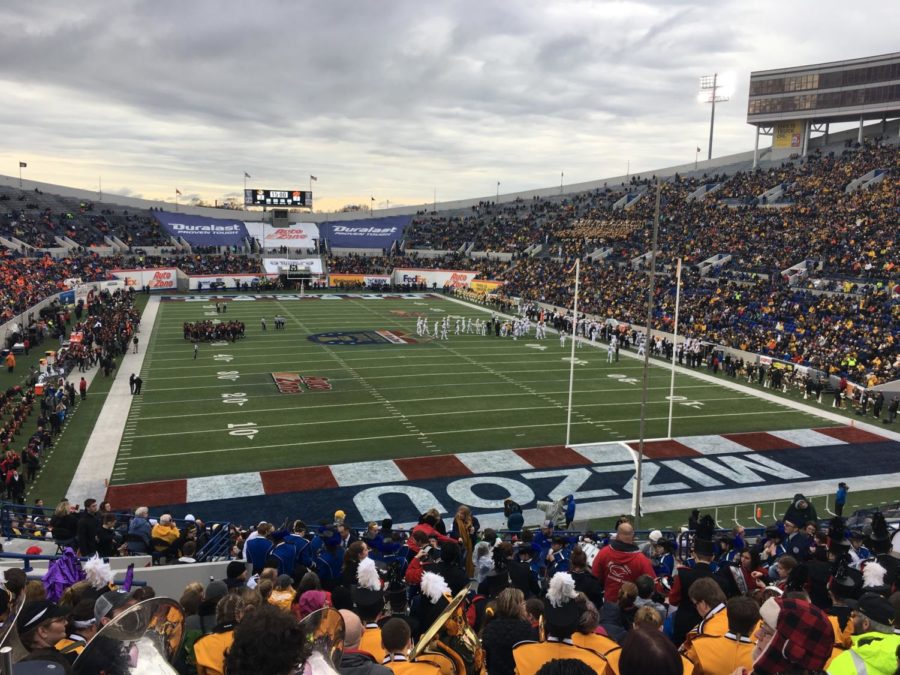 The Warrior Marching Band and Color Guard sat in the University of Missouris end zone at the Auto Zone Liberty Bowl. 