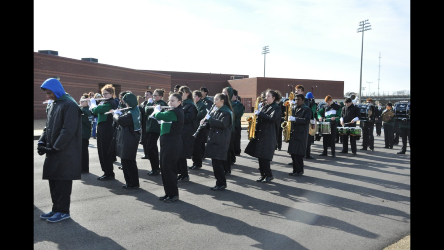 Members of the band get into formation as the parade begins. 
