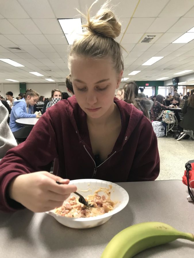 Sophomore Tori Skeens eats pasta with a banana on the side. 
