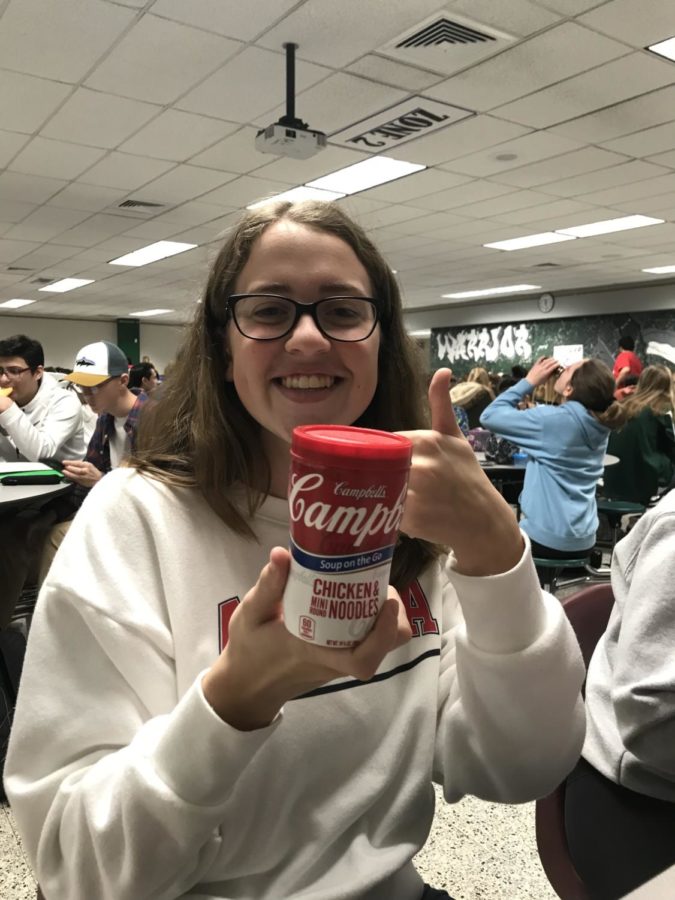 Sophomore Brooke Fanizzi shows her Campbells Chicken Noodle Soup.  
