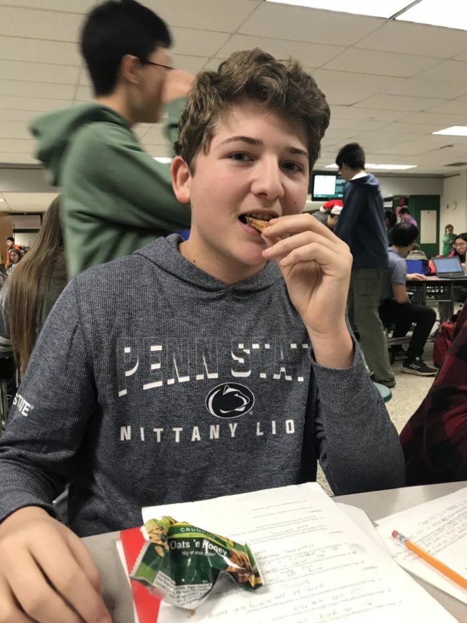 Sophomore Zach Blane eats his favorite granola bar at lunch.  

