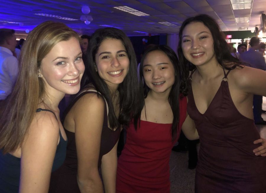 A group of  freshman girls admired the decorations put out in the hallway as they entered the dance. 
