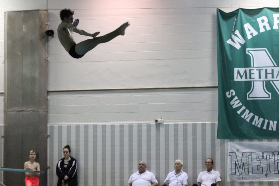 Sophomore Travis Henrick executed a one-and-a-half dive. 
