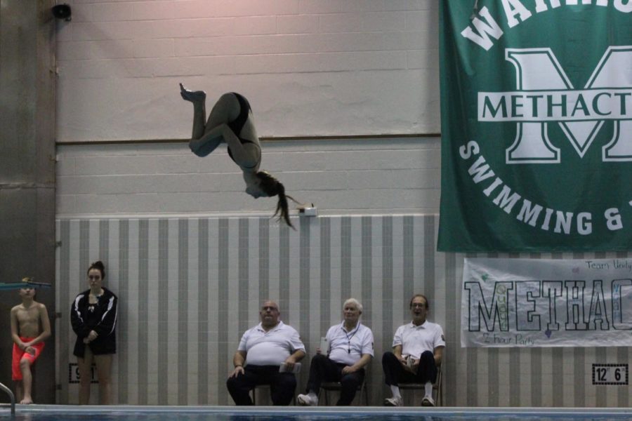 Sophomore Sammie Burstein performed a forward rotation during the diving portion of the match up. 

