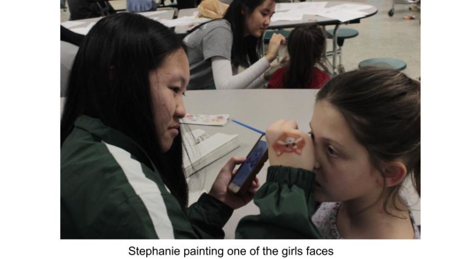 Multi-cultural club member Stephanie was one of the evenings face painters. 
