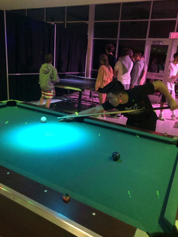 Corey Morabito plays a game of pool. 
