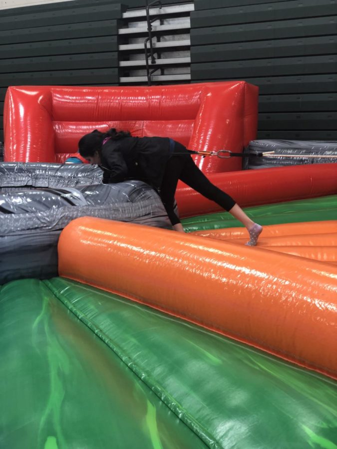Isha Shah, a junior, participates in a game of Hungry Hungry Hippos. 
