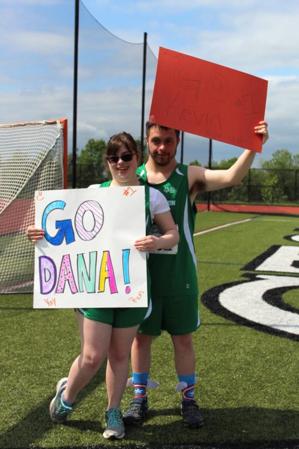 Seniors Dana Meoli and Kevin DiSanto pose together with their posters.
