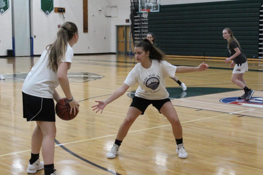The girls play a three on three game while Tori Bockrath and Nina martino practice their offensive and defensive skills. 
