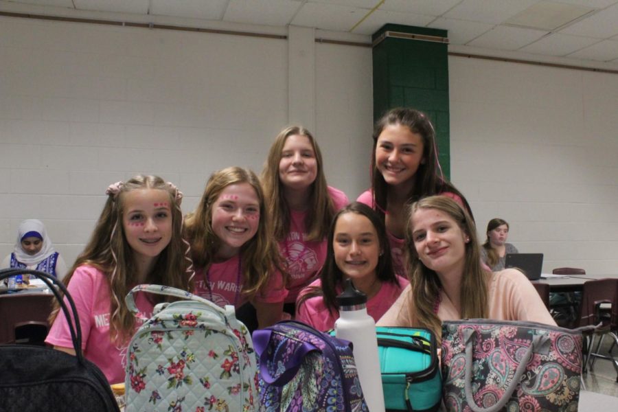 (from left) Isabelle Gerhart, Mandy Baldwin, Kendall Richardson, Riley McDonald, Gabby Baker, and Analiesa Geiling eat lunch while dressed in pink.