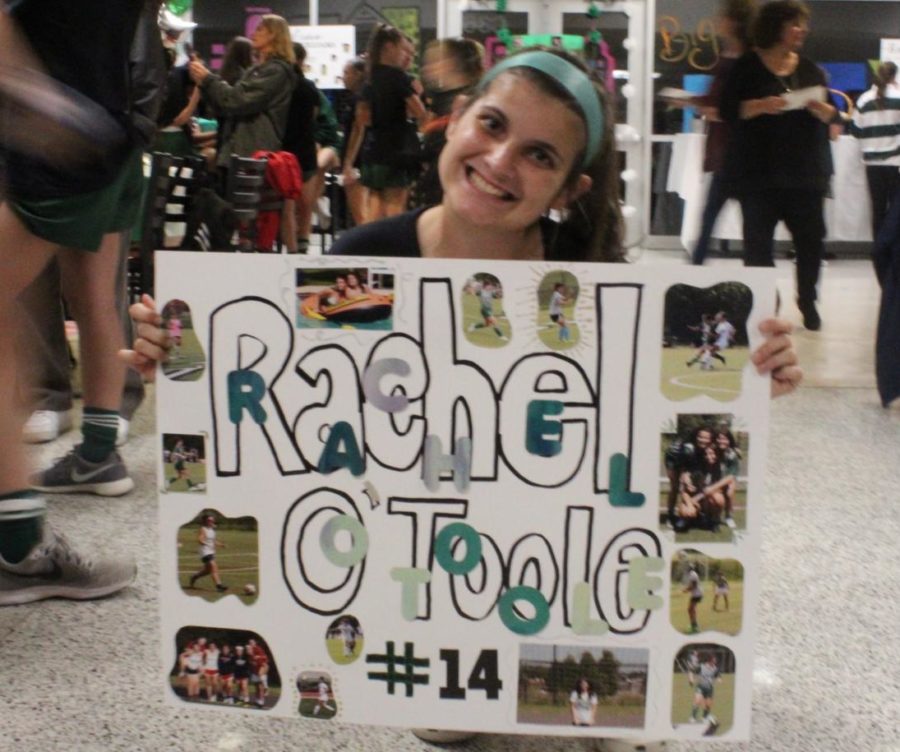 Senior Rachel O’Toole poses with her poster. 
