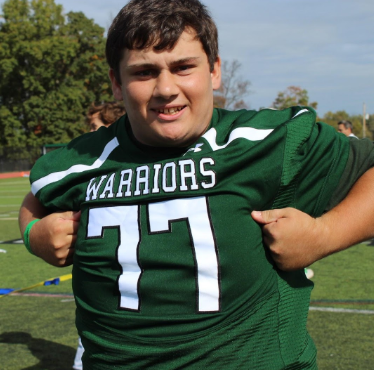 Sorgini celebrates a win over the freshmen in the annual tug of war.