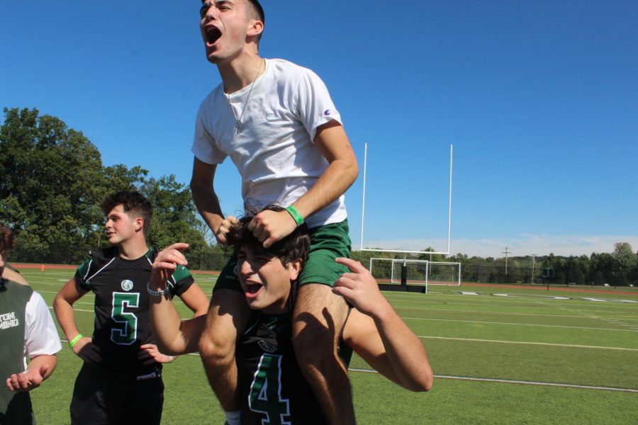 Seniors Mike Carfagno and Dean Sapalidis celebrate their win against the sophomores. 
