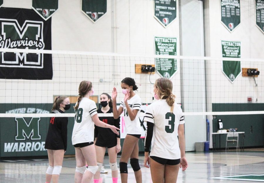 Madison Roeger and Makayla Batten cheer each other on before every serve.
