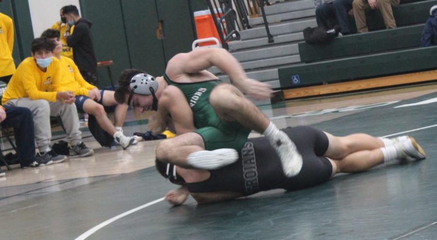 Brody Borkowski repositions himself over his opponent during the first period.