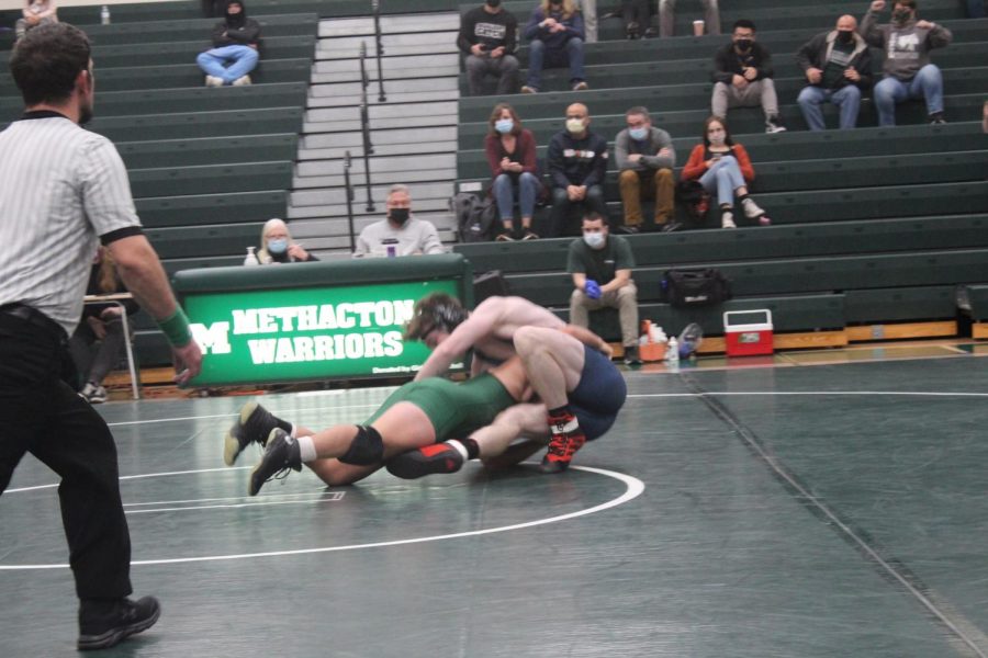 Isaiah Peoples takes down Wissahickons Evan Prestipino during first period action. 
