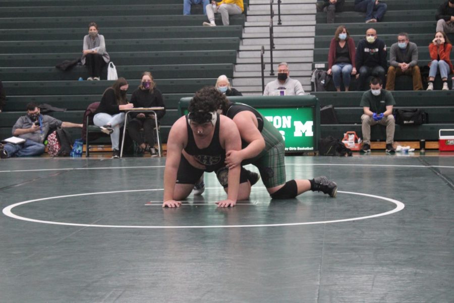 Damian Moser awaits the referees whistle to continue wrestling Wissahickons Ryan Lee.
