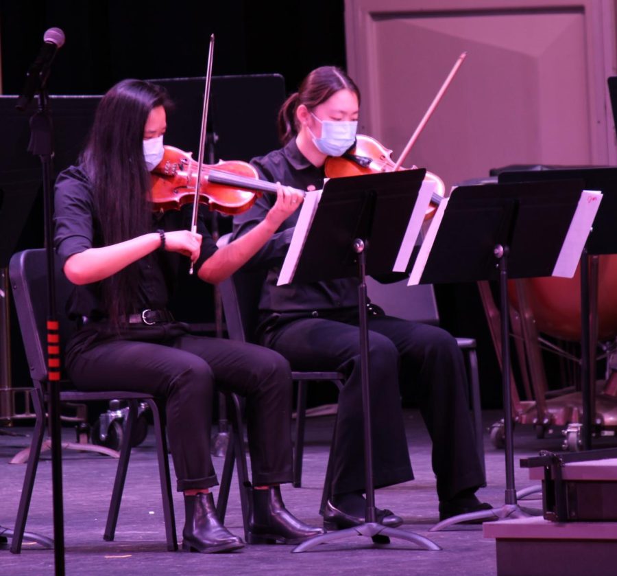 Violinists Victoria Fan and Anna Lu perform Alleluia.
