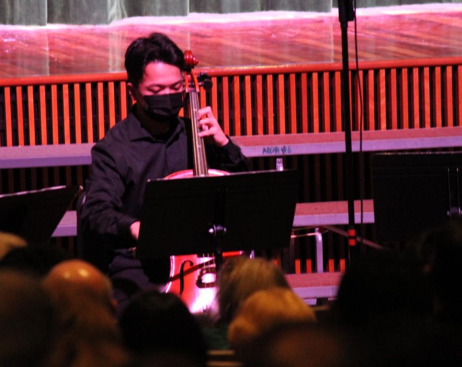 Junior Alex Kang, member of the cellist ensemble, contributes vibrato to the piece.