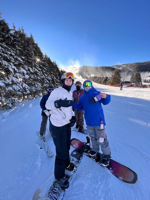 (from left) Sophomores Cole Dutton and Jason approve of Blue Mountain after making their first run.  
