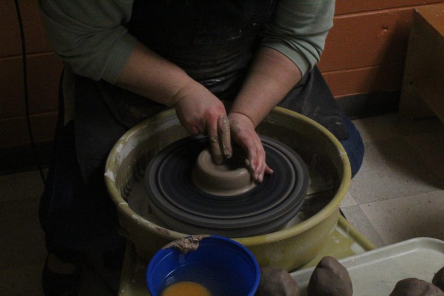Next, the artist extends the clay her liking, continuing to build walls. 
