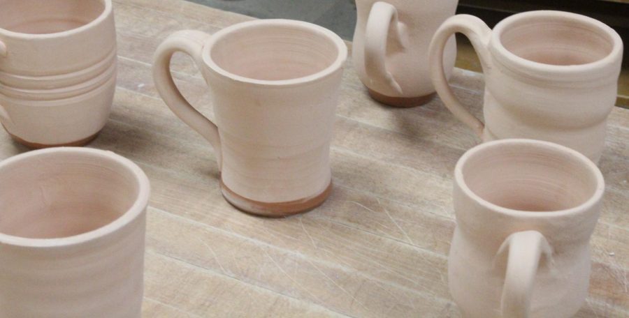 After being heated in the kelm and having handles added, the mugs are then glazed. 
