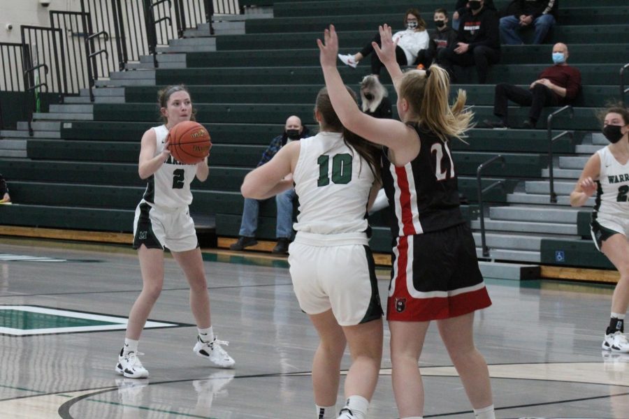 Ashley Fisher fields an assist from Abby Arnold. Fisher would drain a three pointer on the play. 