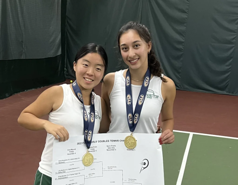 Proud Methacton champs hold up the 2022 PIAA 3A Girls’ Doubles Tennis Champion bracket.