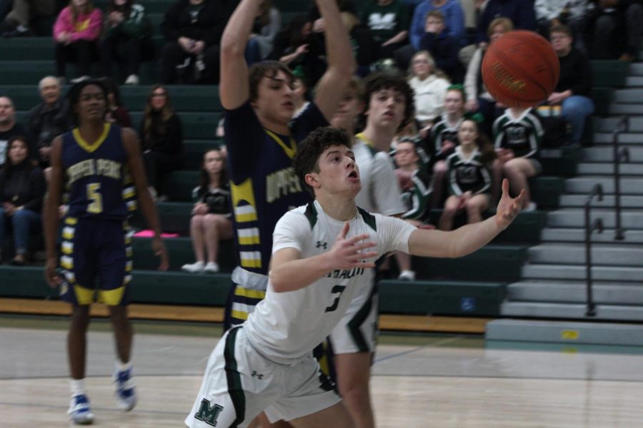 Senior Jason Lagana hustles to get a rebound before it goes out of bounds.
