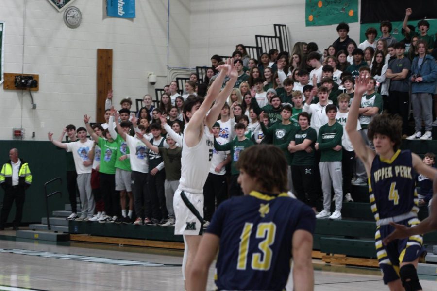 Senior Matt Christian shoots a three ball. He ended the game with 33 points, 24 coming in the first quarter.
