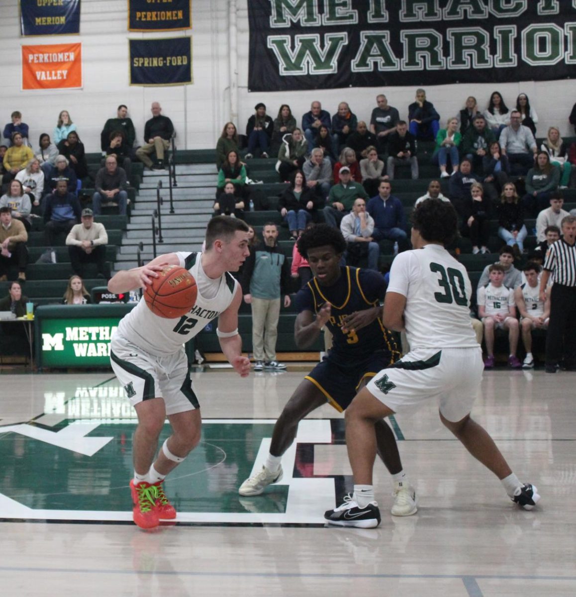 Senior Sal Iemmello dribbles by a defender after junior Wes Robinson sets a pick.