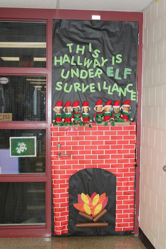 Dr. Euker’s “Elf on the Shelf” theme door is a creative and humorous nod to the principal and various administrators' surveillance over the building. 