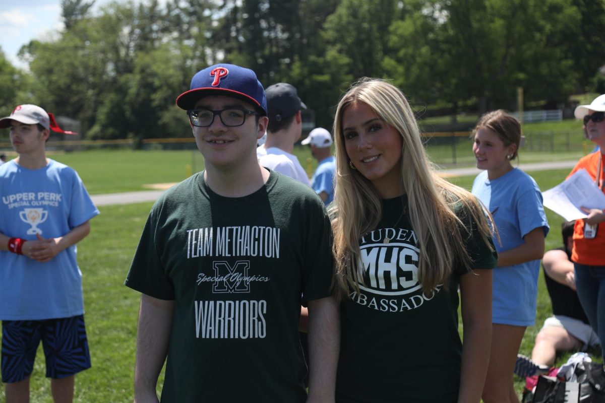 Sean Molinelli and Aubrey Patton stand together prior to the softball throw, one of three events at the Special Olympics in PA. 
