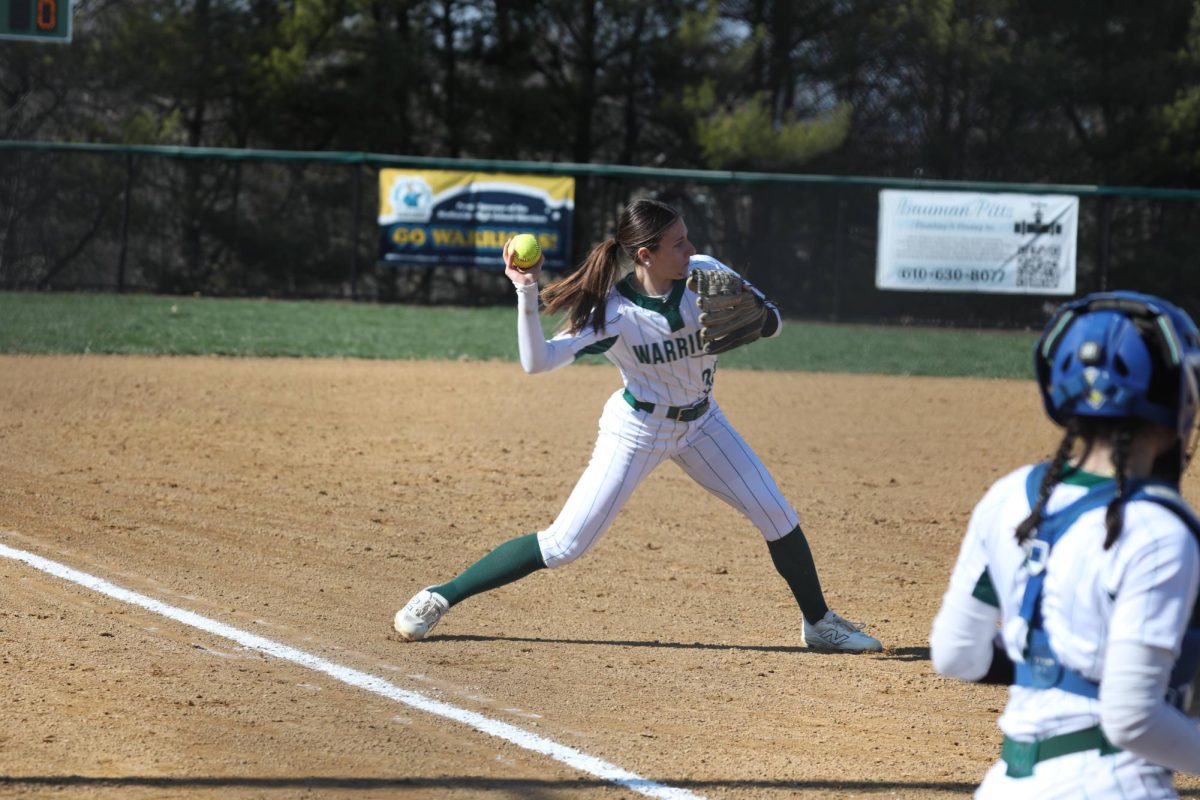 Senior Jillian McTamney throws to first base during warm ups in early season play. The future Salisbury University player said she likes that her team is able to rise above in-game shortcomings.
